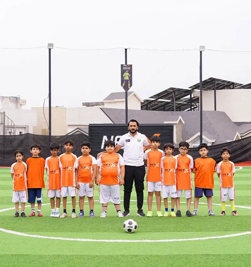 NETX youth football team and coach