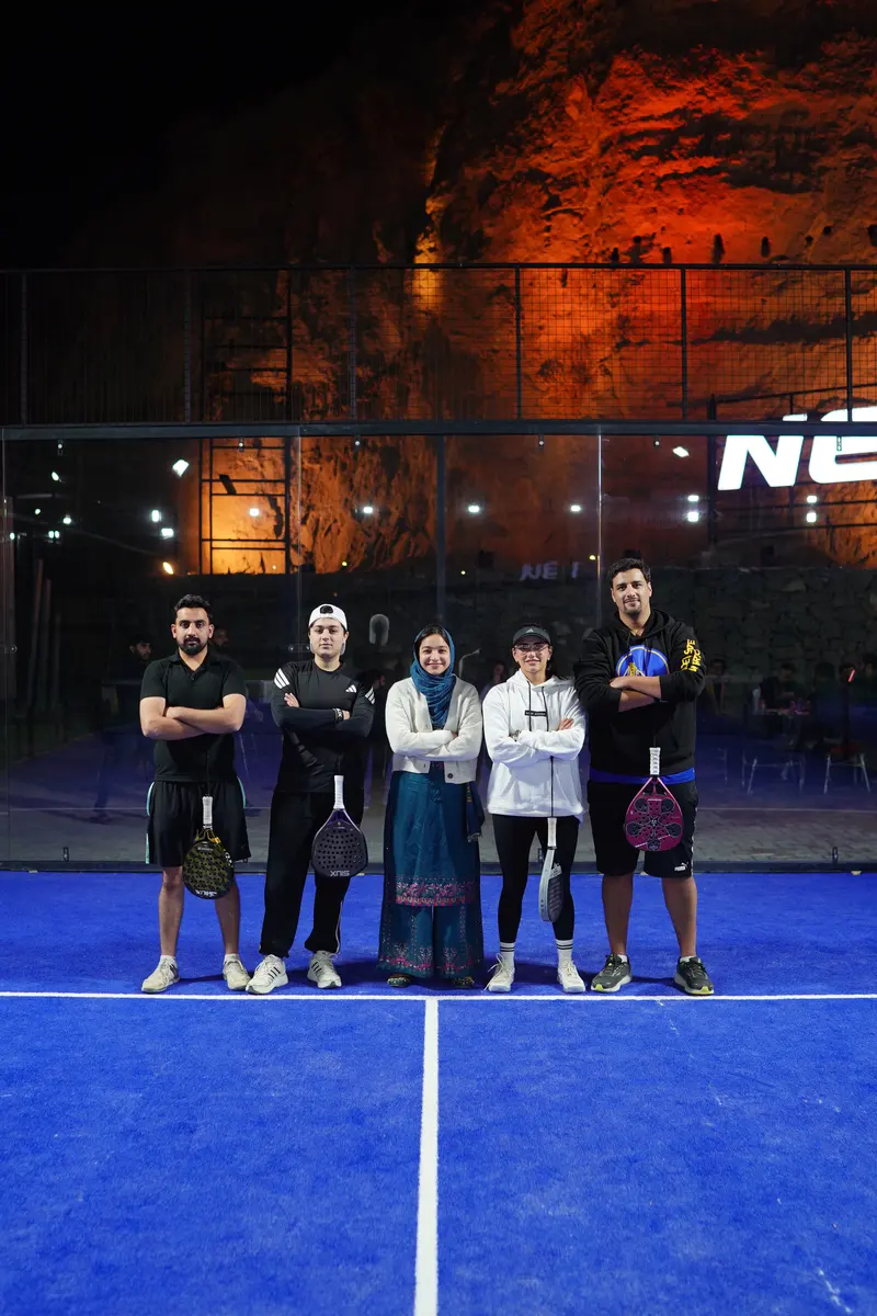 Friends with rackets on the NETX padel court
