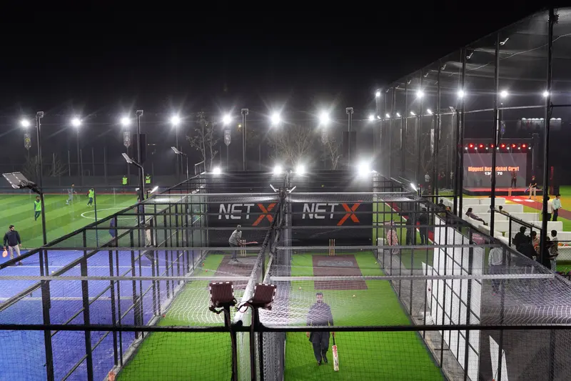 Both NETX bowling machine lanes under floodlights
